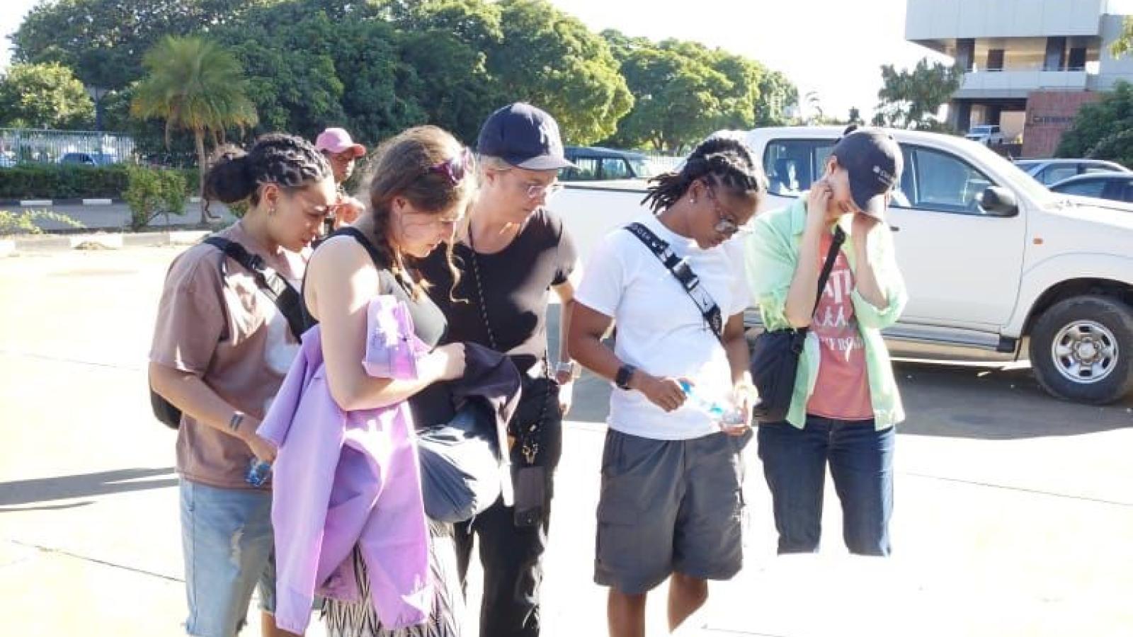 Global fellows in Zambia looking at a historical monument