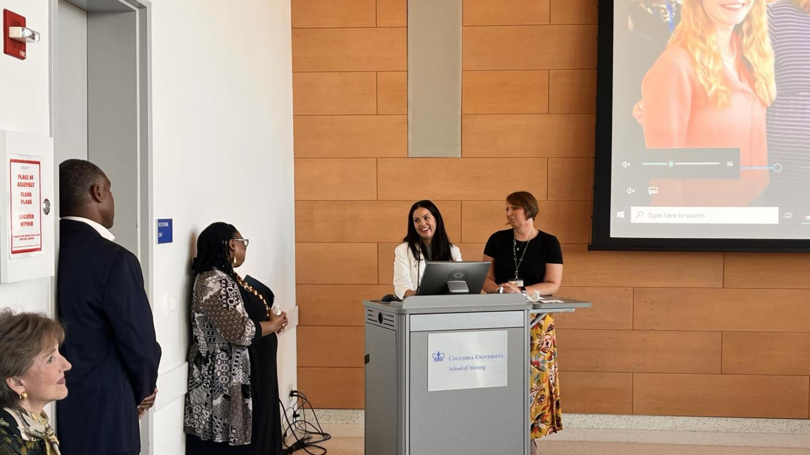 Colleagues and family honoring Vivian Taylor at reception