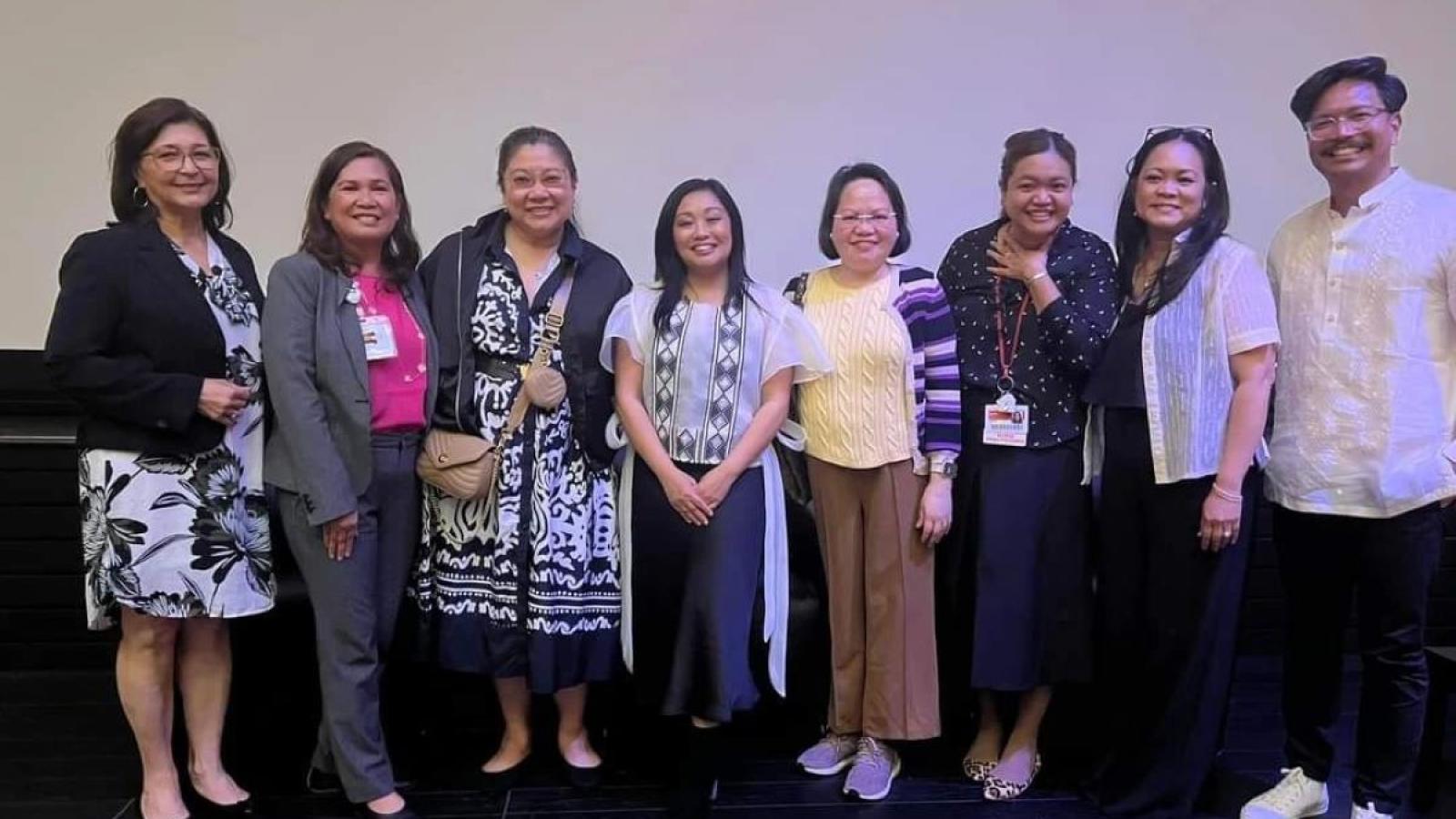 Group of film screening participants in auditorium