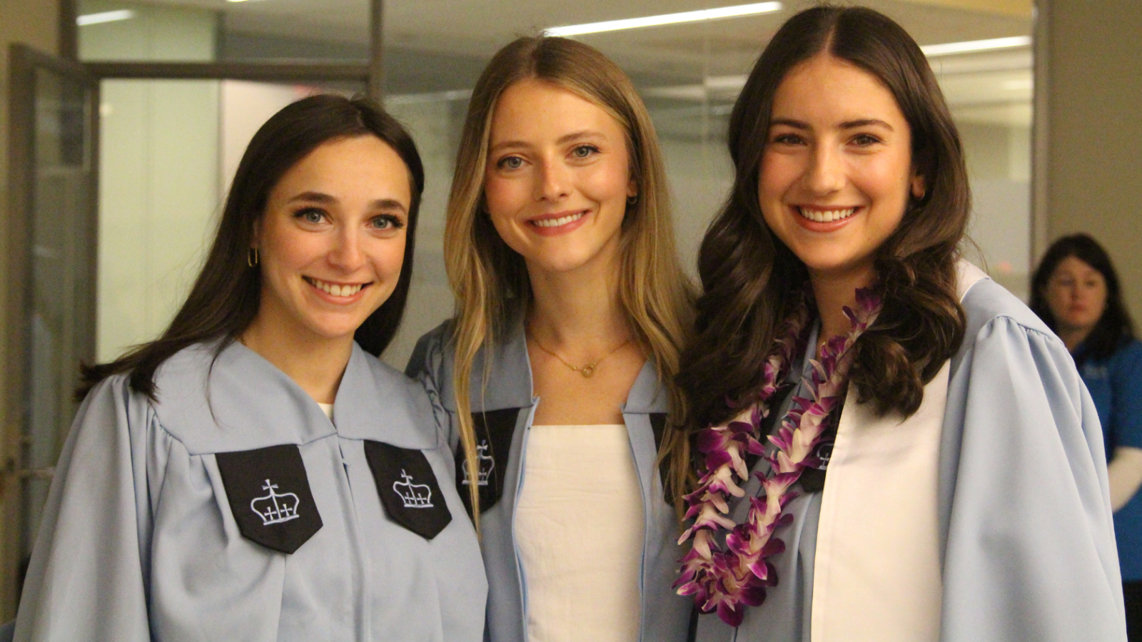 Three female graduates in their regalia