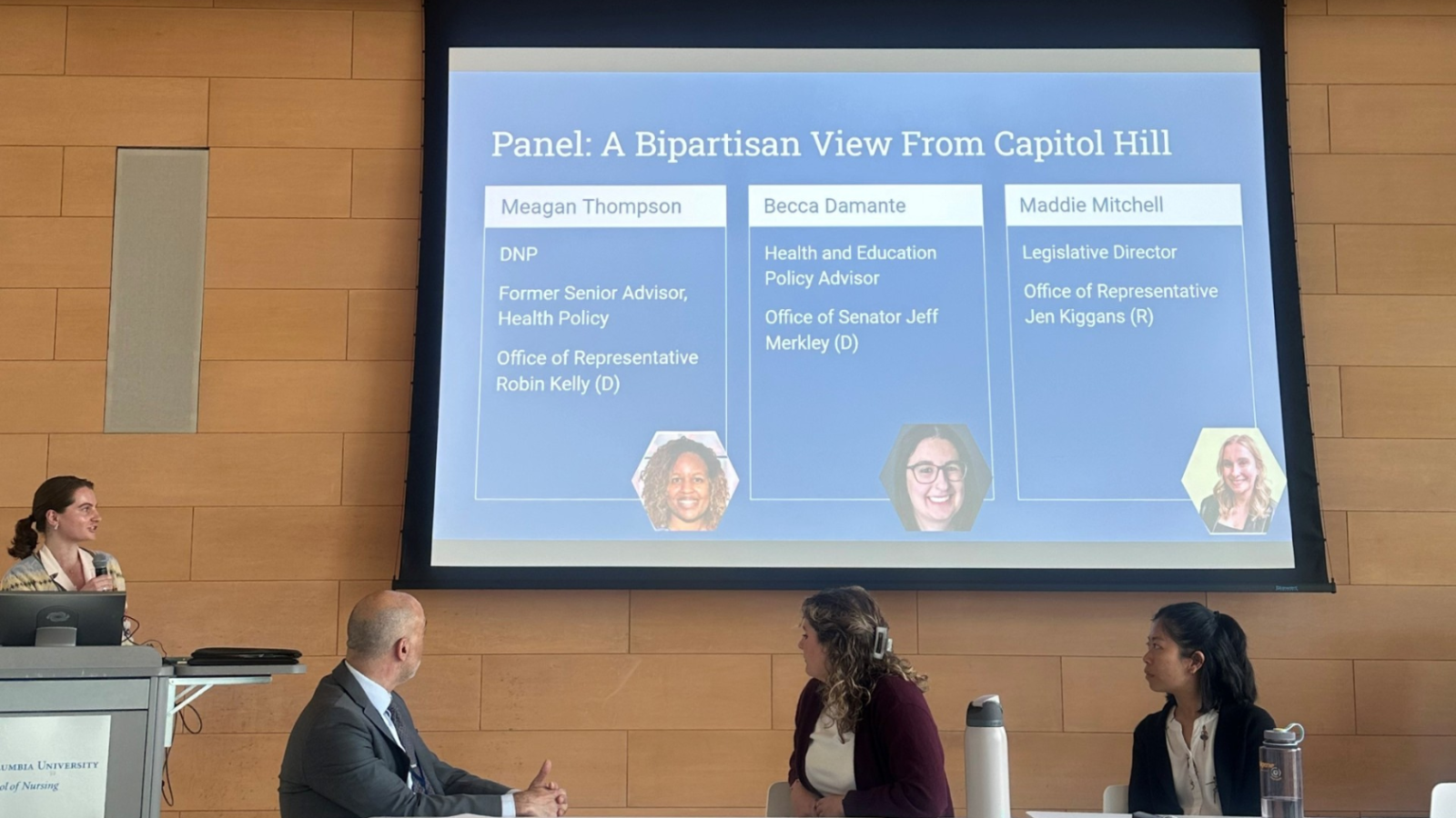 Student presenting in front of panel