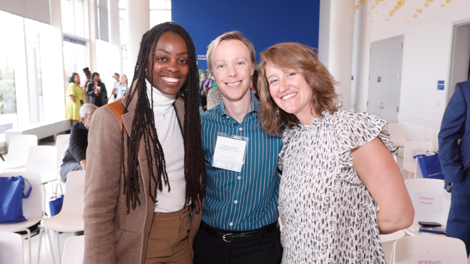 Three Columbia Nursing alumni and faculty posing for a photo