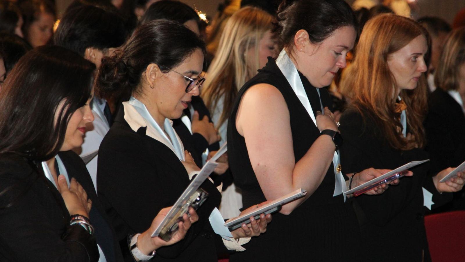 Nursing students reciting nursing pledge after pinning ceremony