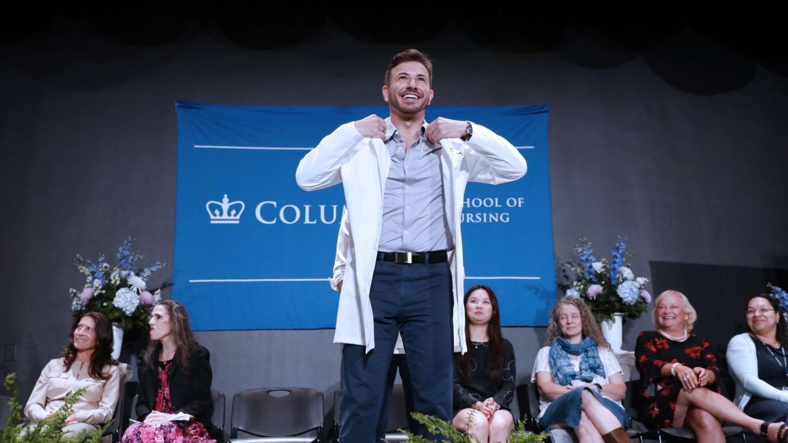 Student receiving their coat at White Coat Ceremony 2024