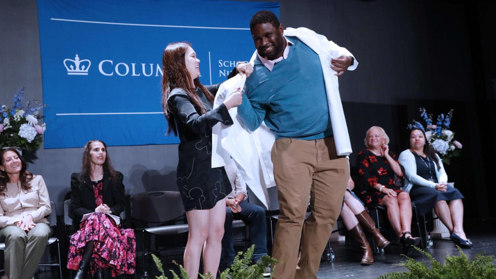 Student receiving their coat at White Coat Ceremony 2024