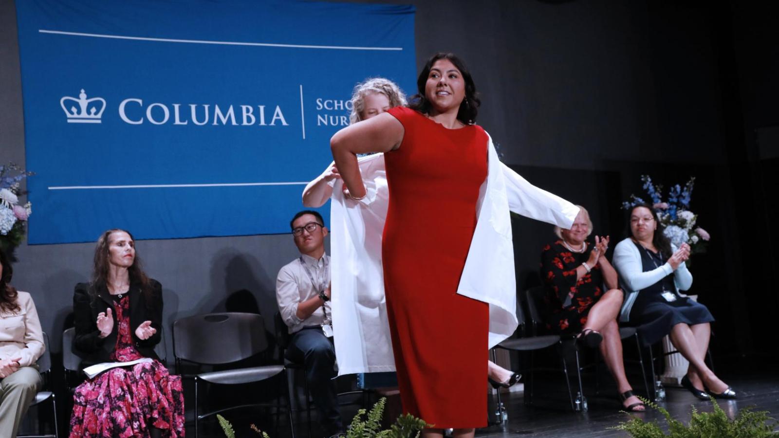 Student receiving their coat at White Coat Ceremony 2024