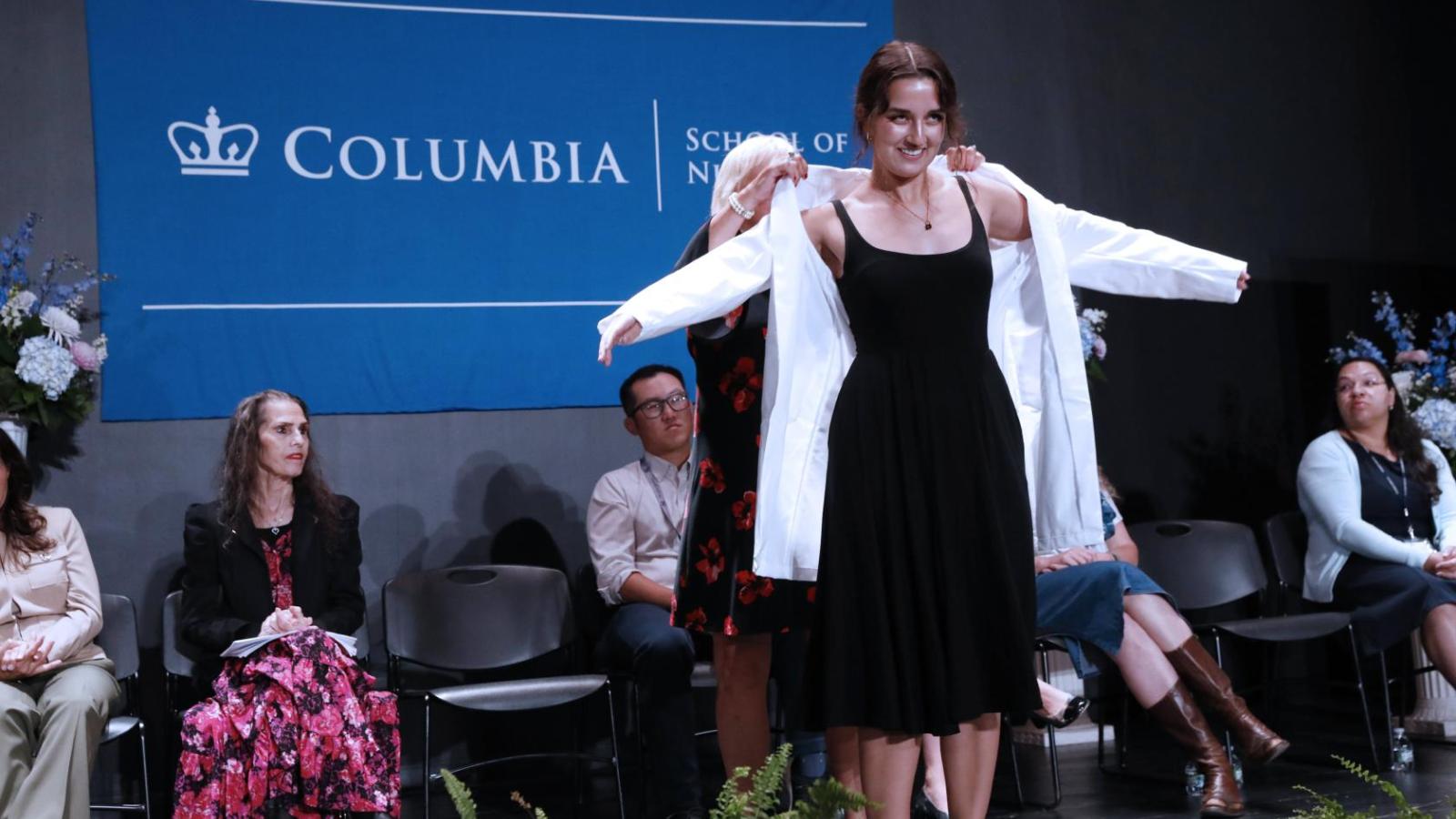 Student receiving their coat at White Coat Ceremony 2024