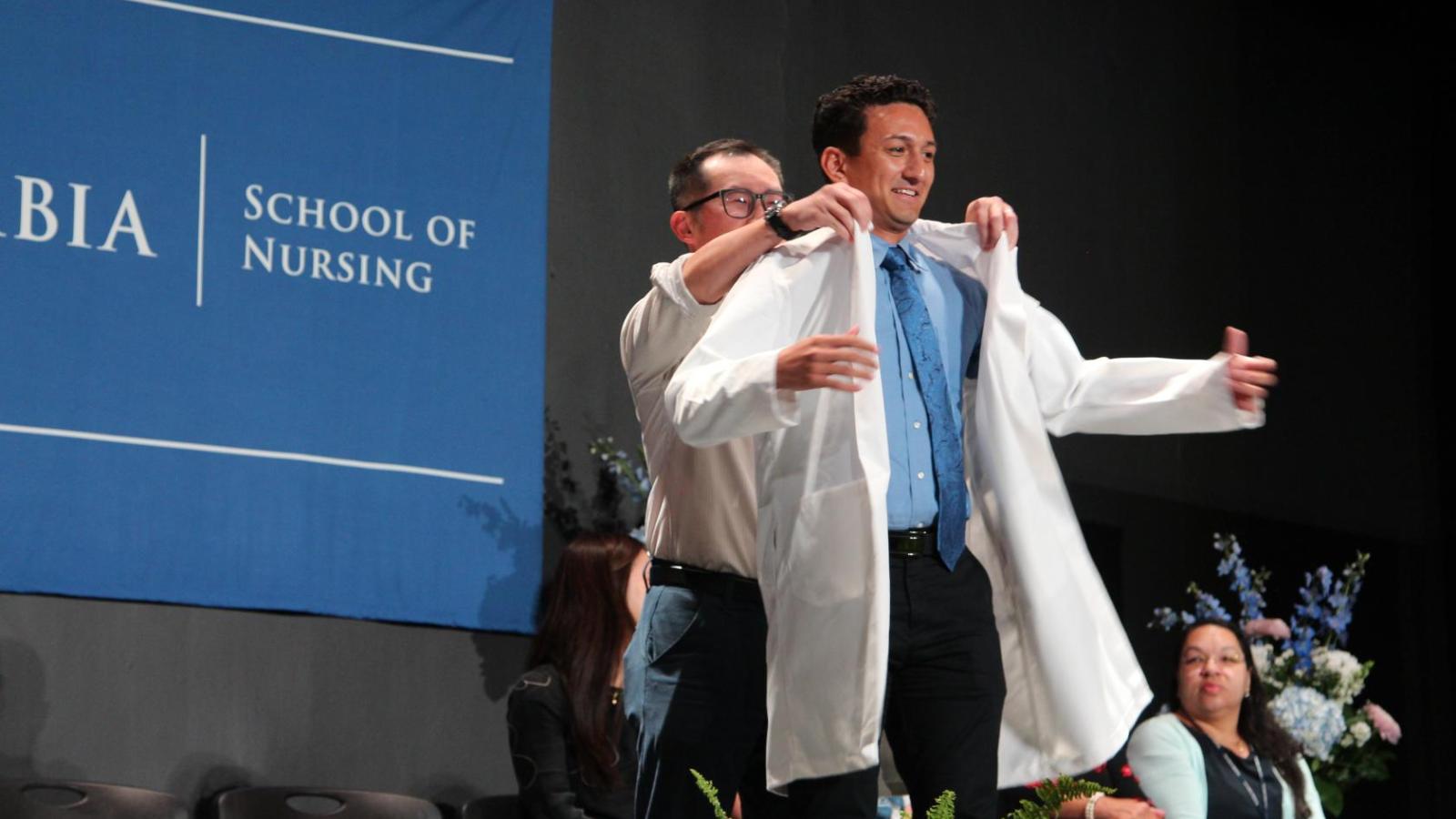 Student receiving their coat at White Coat Ceremony 2024