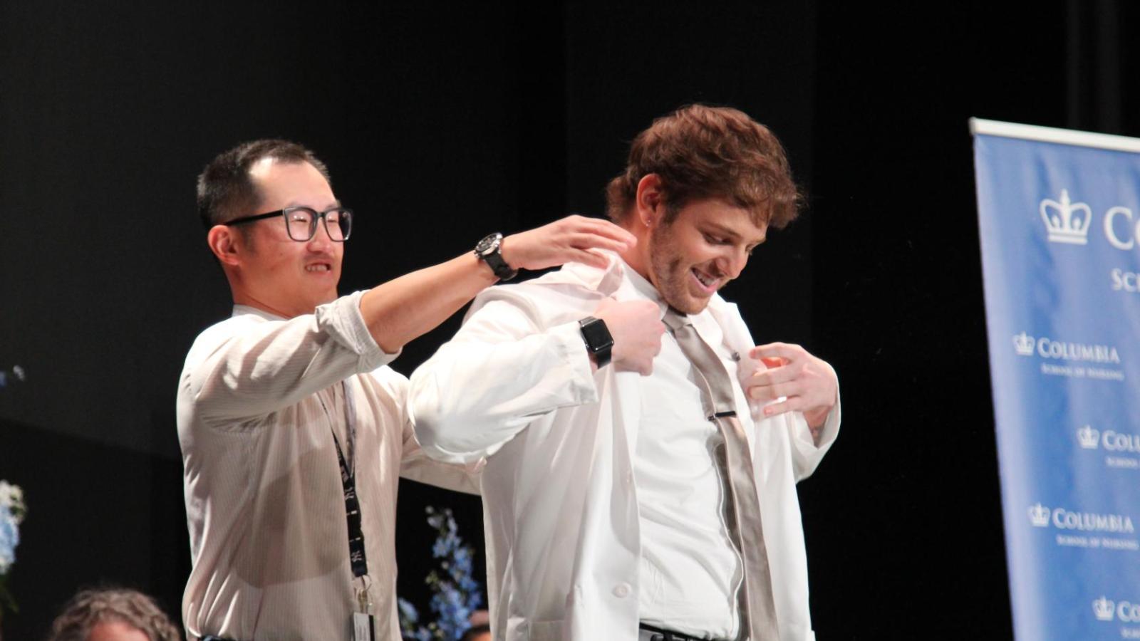 Student receiving their coat at White Coat Ceremony 2024