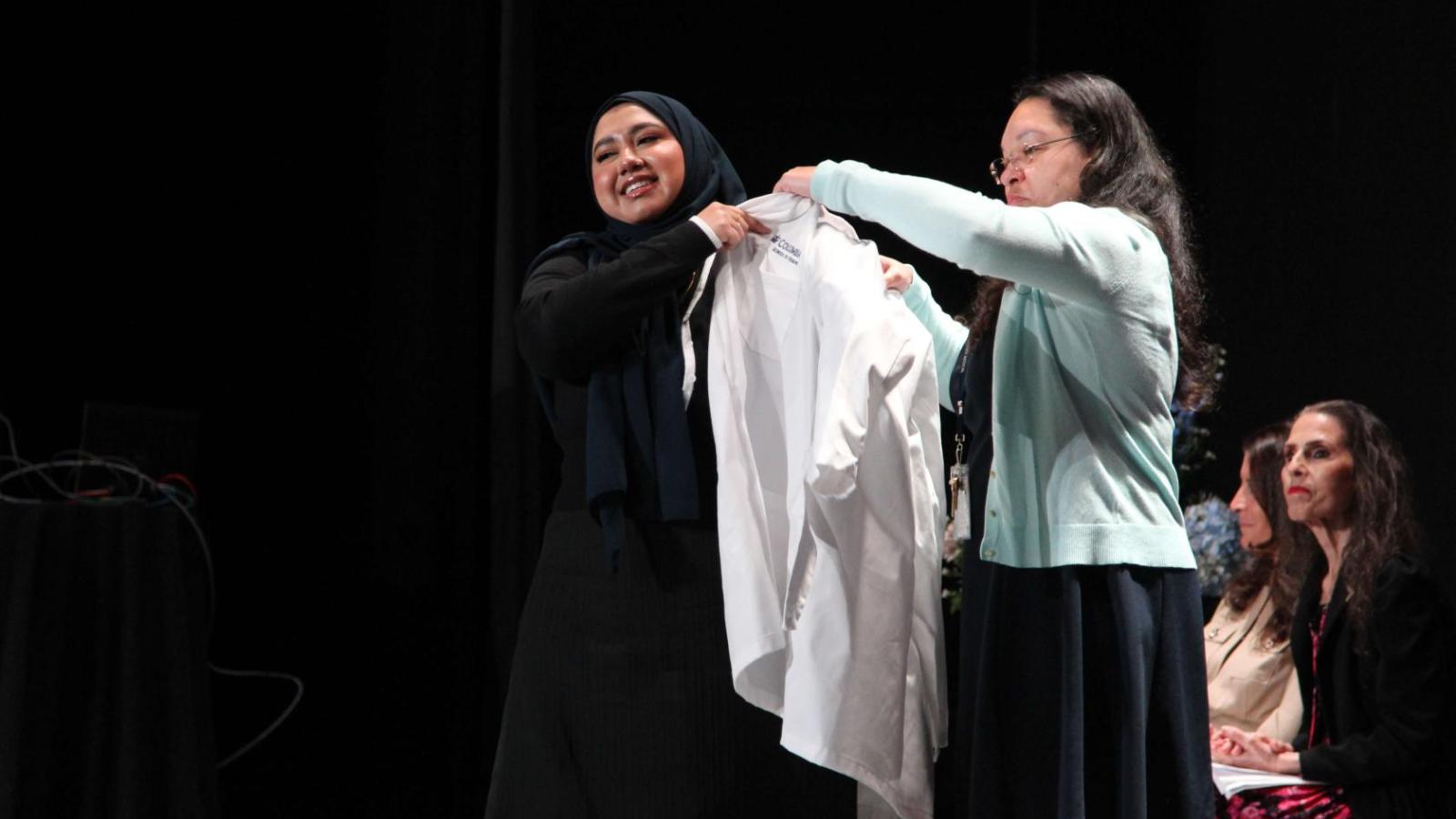 Student receiving their coat at White Coat Ceremony 2024