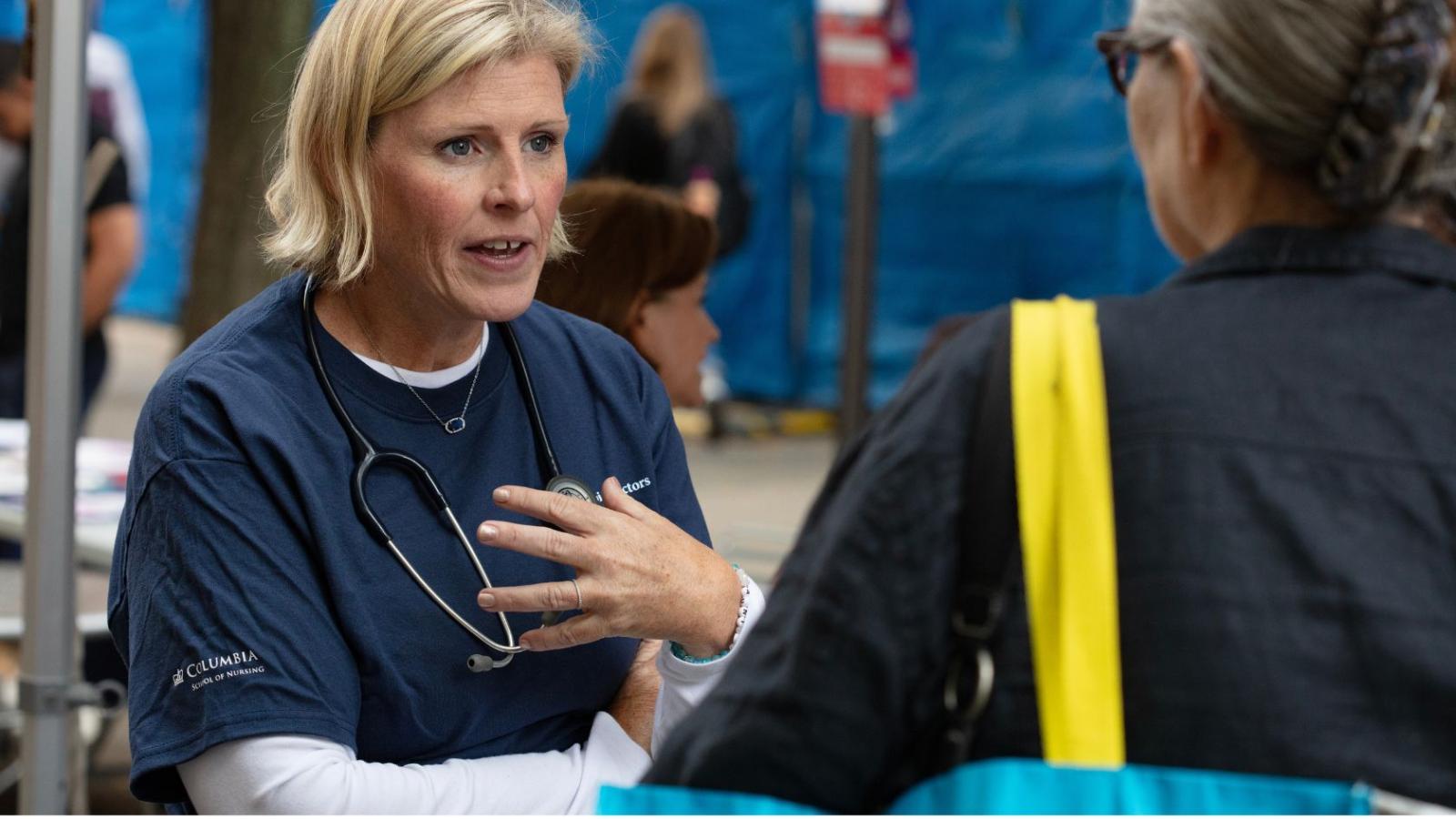 Clinician from the Nurse Practitioner Group meeting with members of community