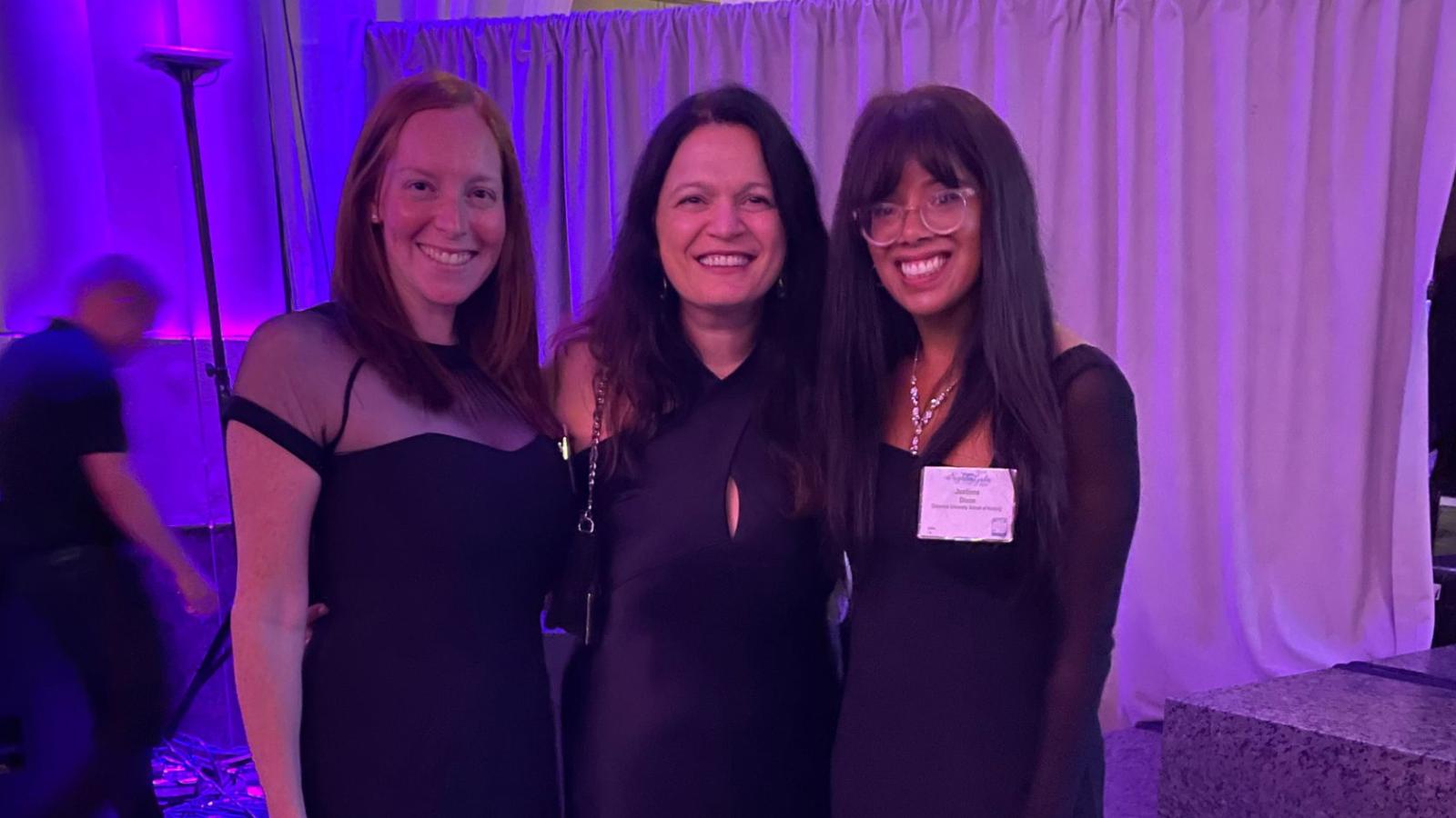 Award winner posing with two student colleagues