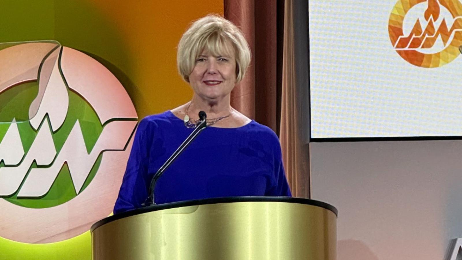 Living Legend Bakken receiving award at podium