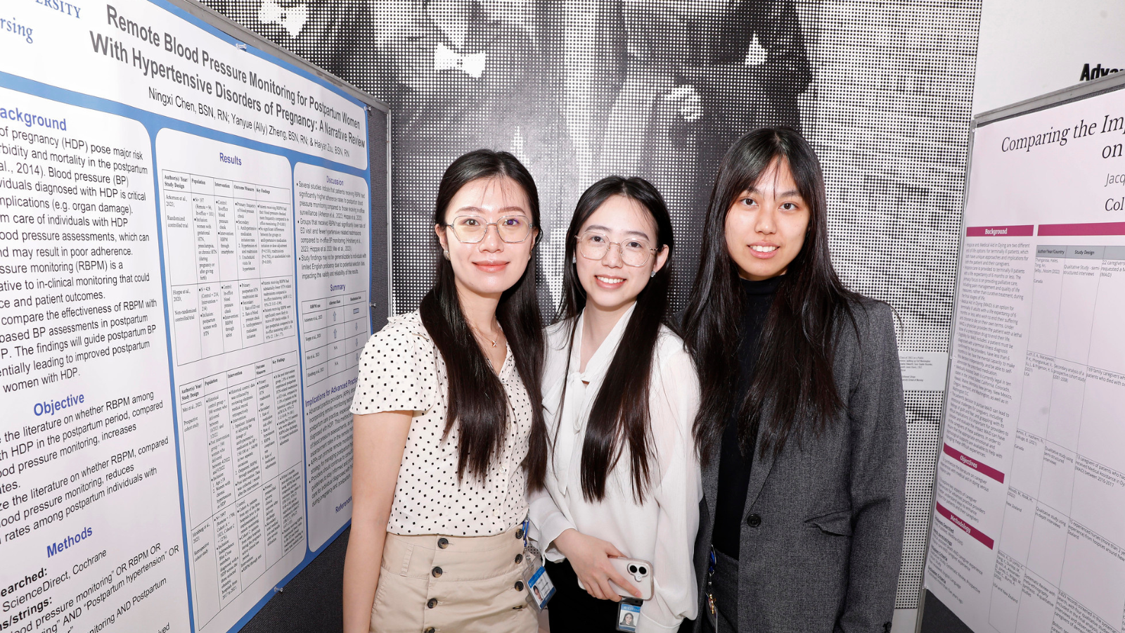 Three students standing near research posters