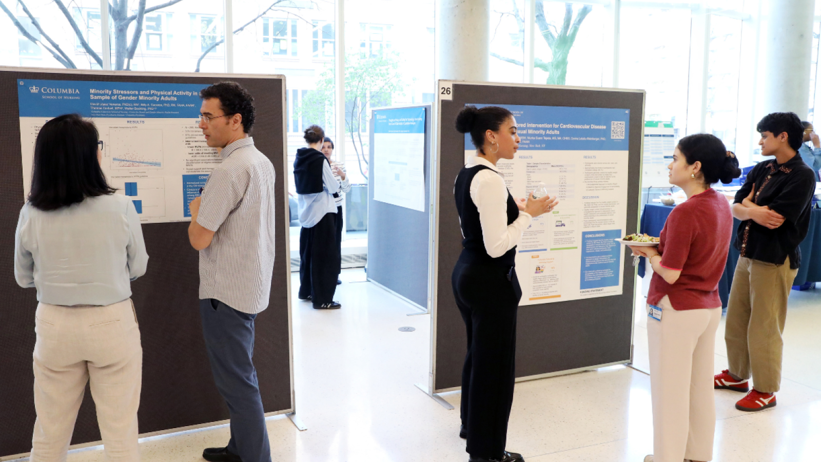 PhD students presenting their posters in the Columbia School of Nursing lobby