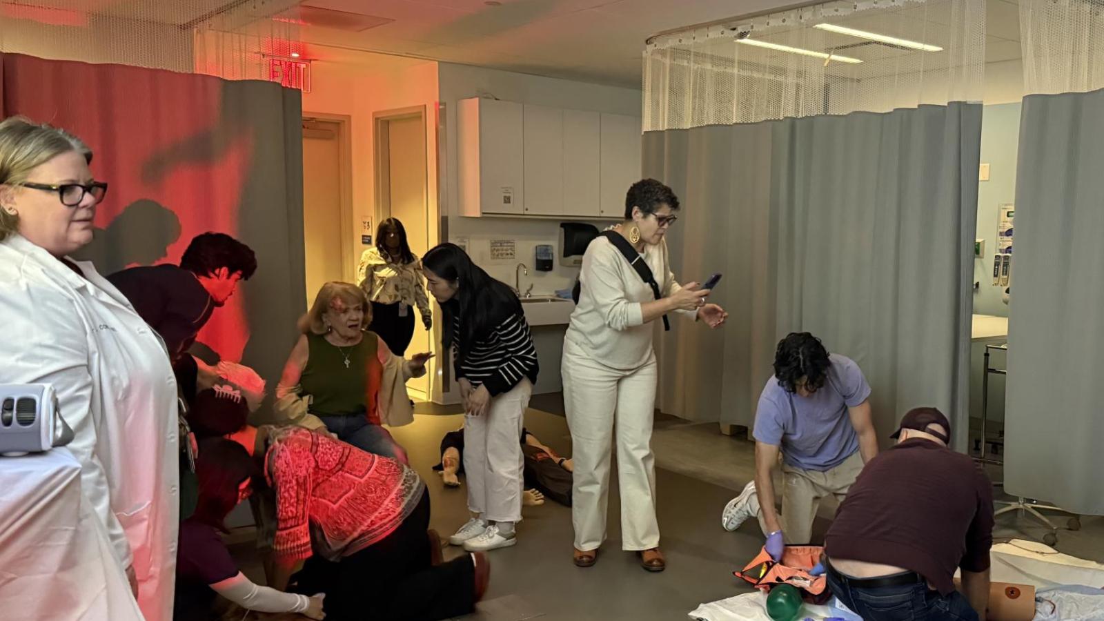 Students participate in train derailment simulation at simulation center during IPE Day