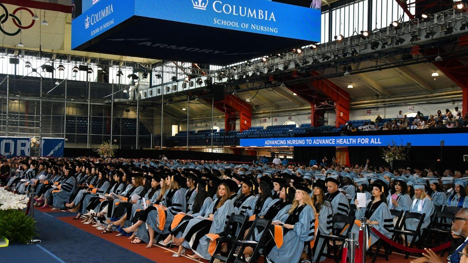 Photo of all Columbia Nursing graduates sitting inside the Armory