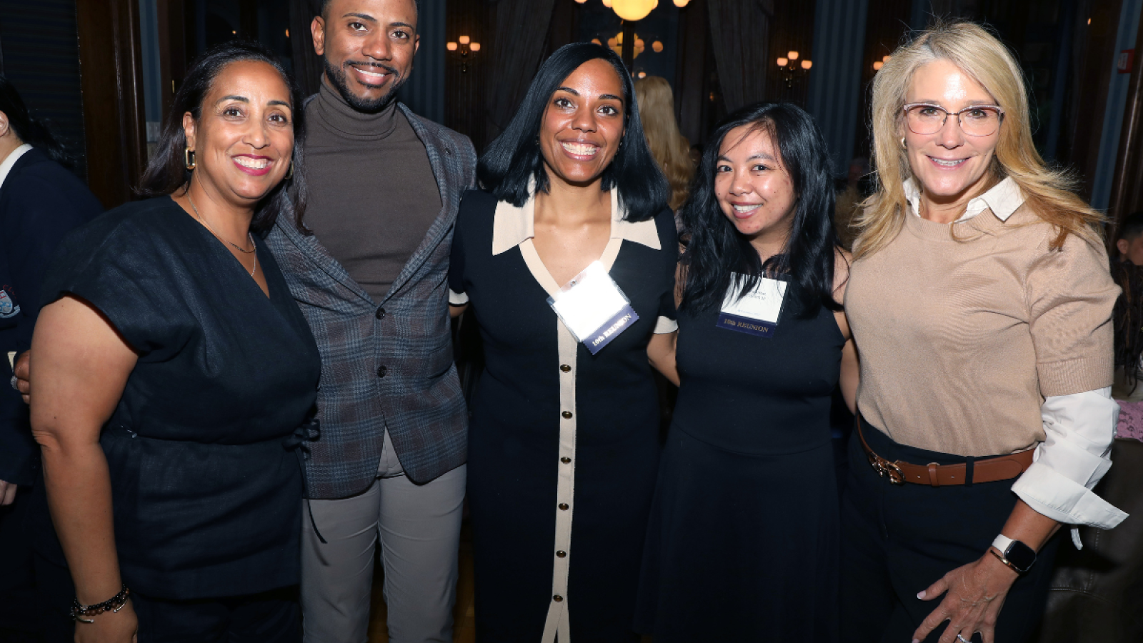 Five Columbia Nursing alumni and faculty members smile for a photo