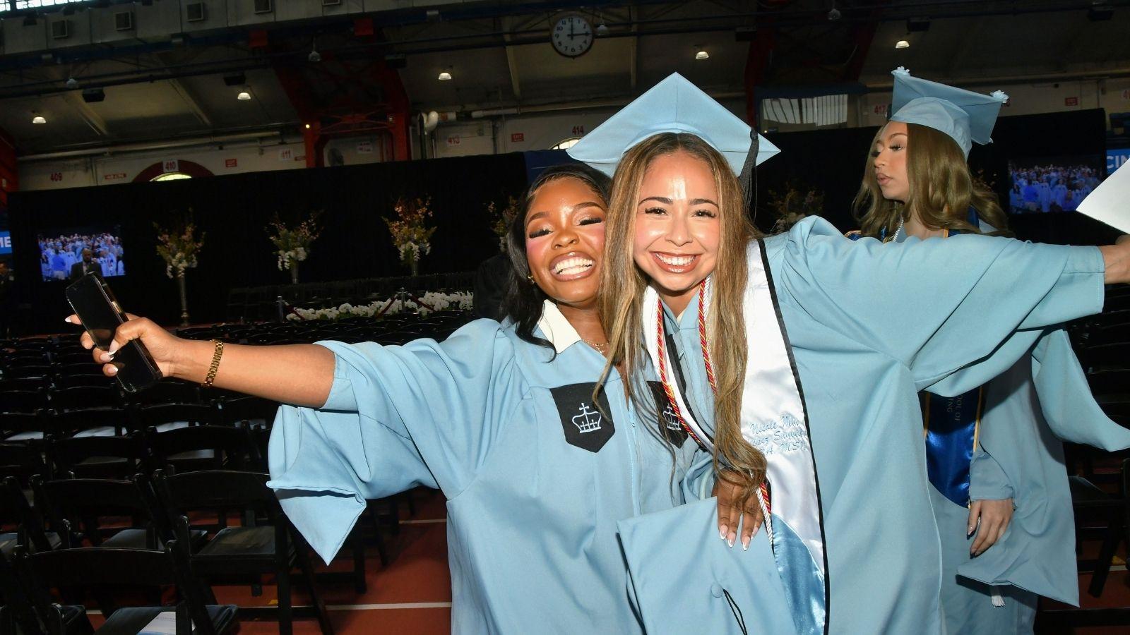 Two Columbia Nursing MDE graduates smile for a photo