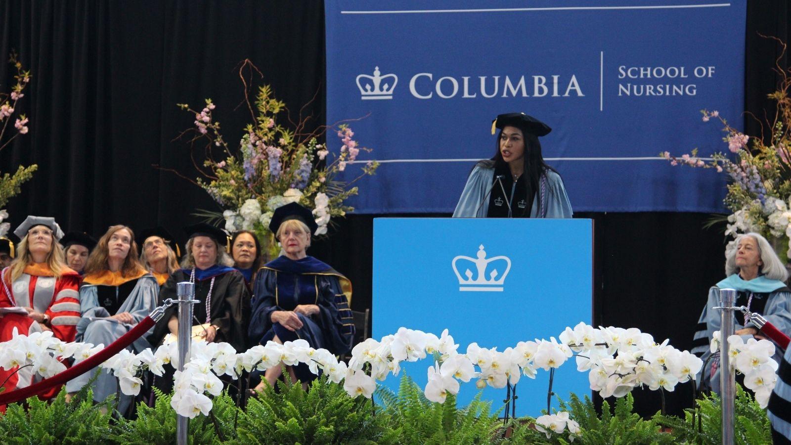 Student speaker Sergine Delma delivering her speech at the podium