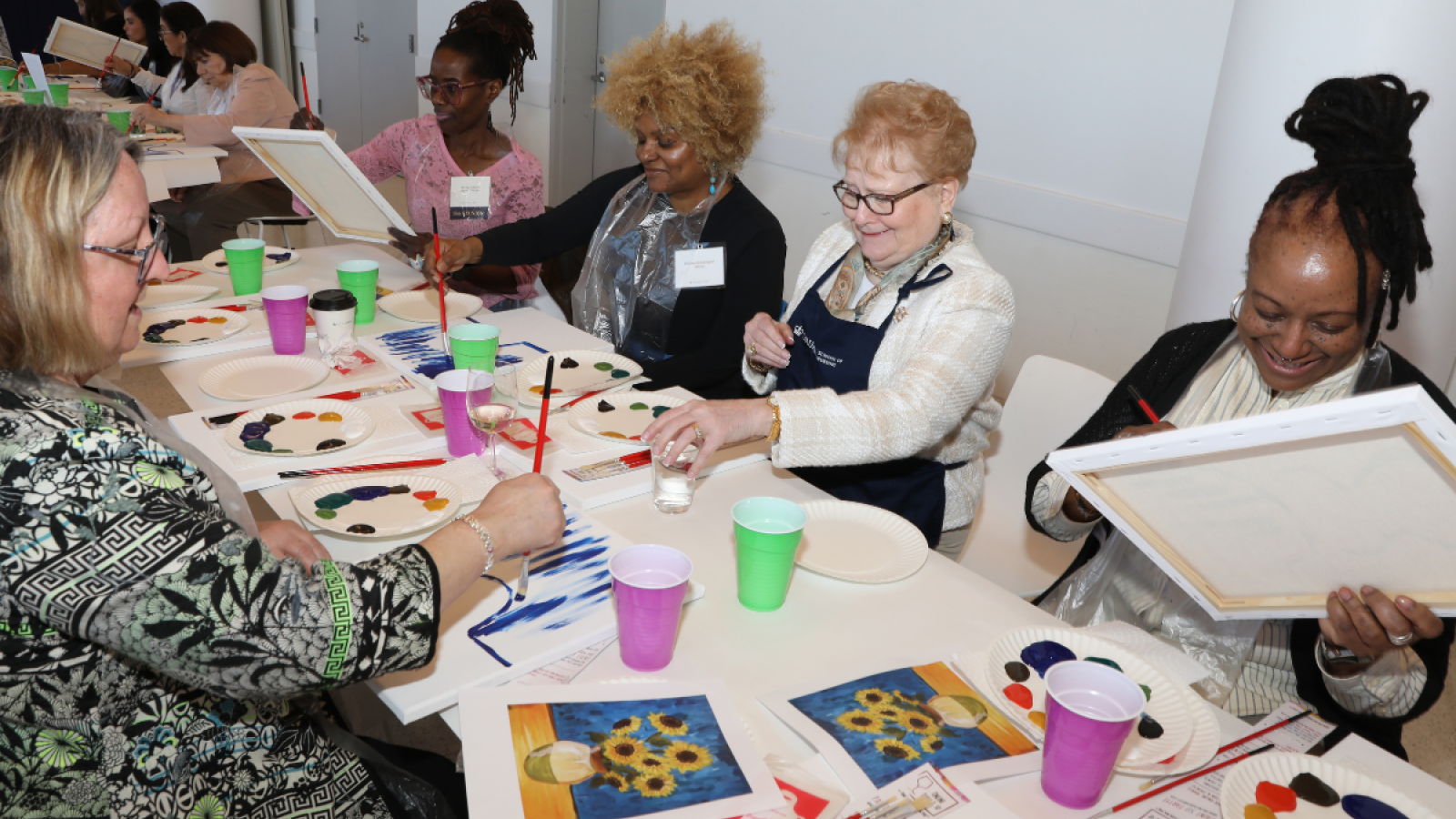 Columbia Nursing alumni painting canvases