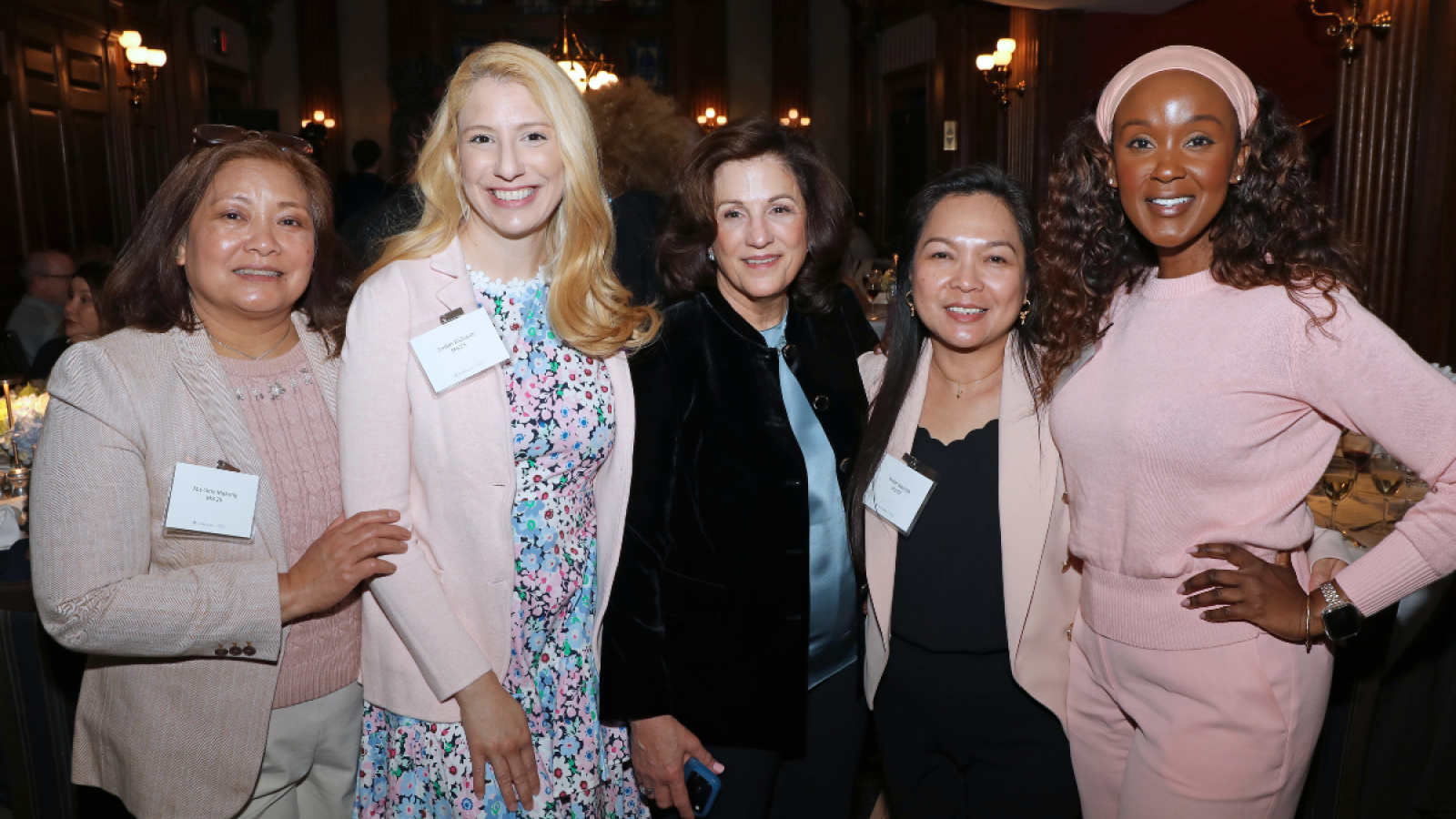 Five Columbia Nursing alumni and faculty members smile for a photo