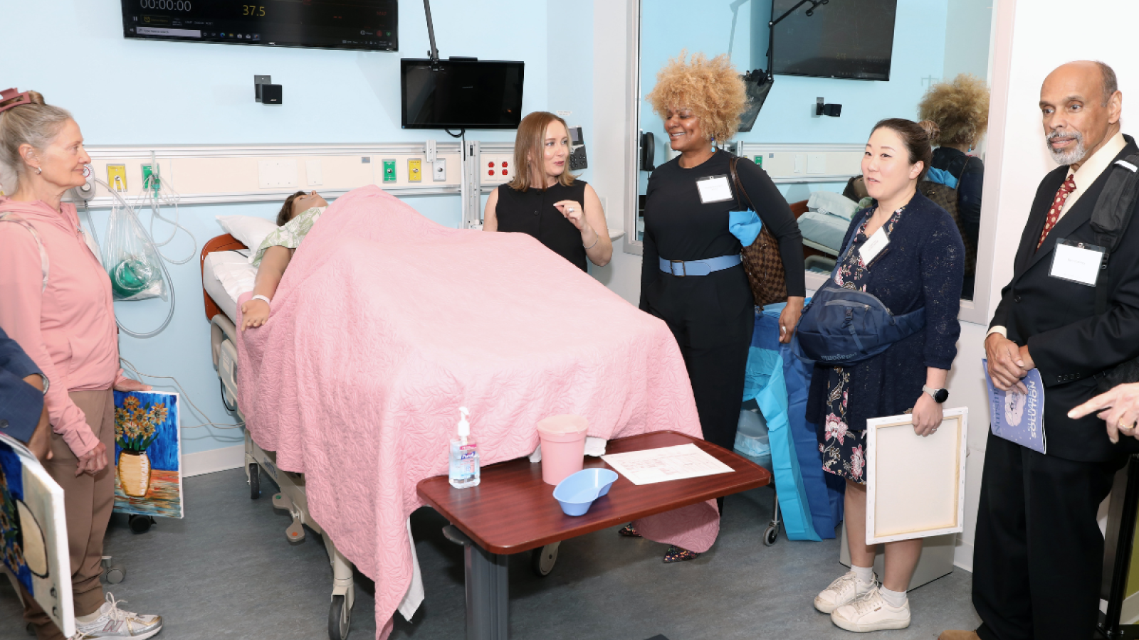 Columbia Nursing alumni taking part in a tour of the simulation center