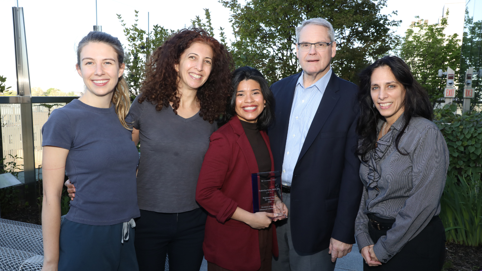 A Nurse Excellence Award winner poses with their colleagues