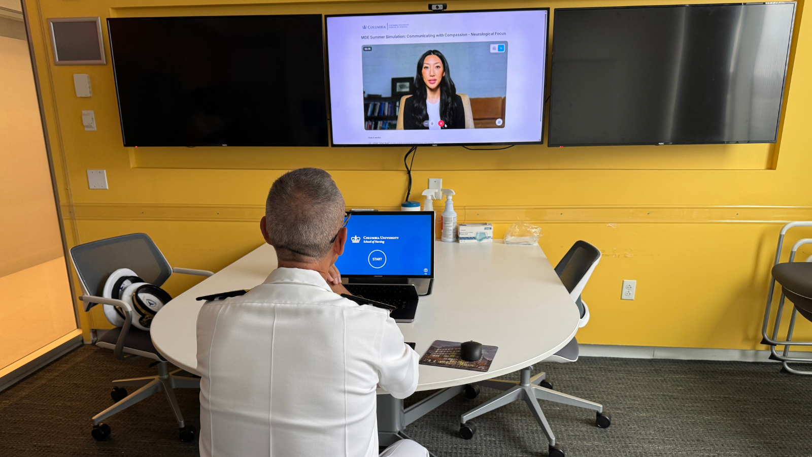 A member of the Navy working with an AI patient