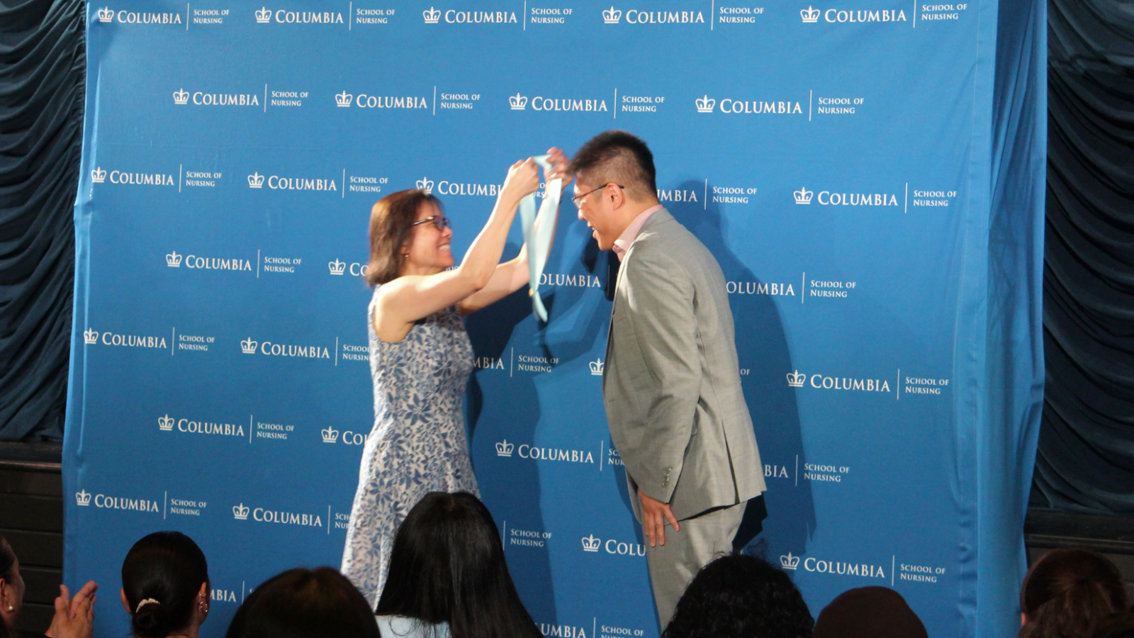 An MDE student celebrating being pinned