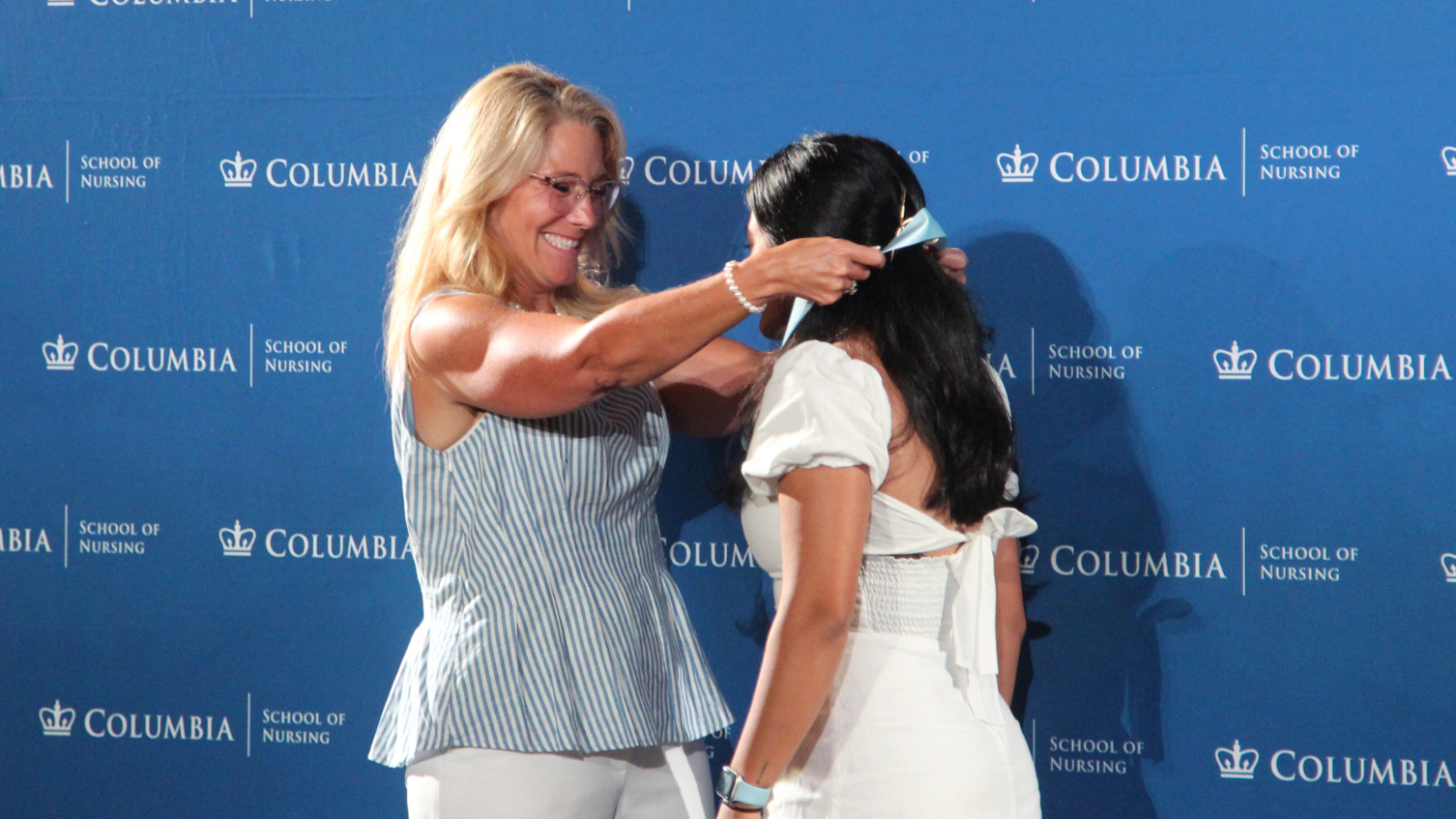 An MDE student celebrating being pinned