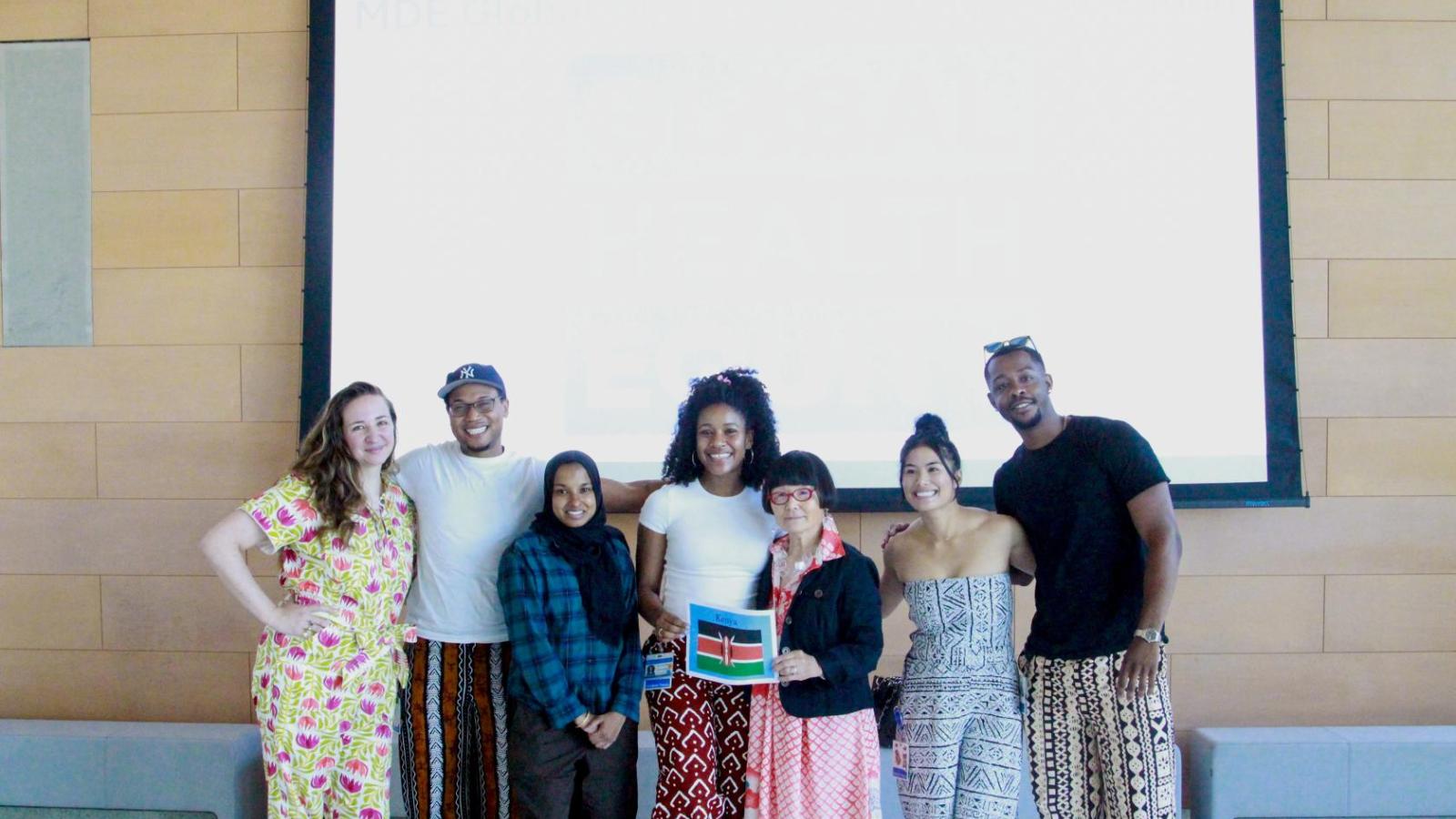 Students who went to Kenya pose with alum Hazue Tamura Stein