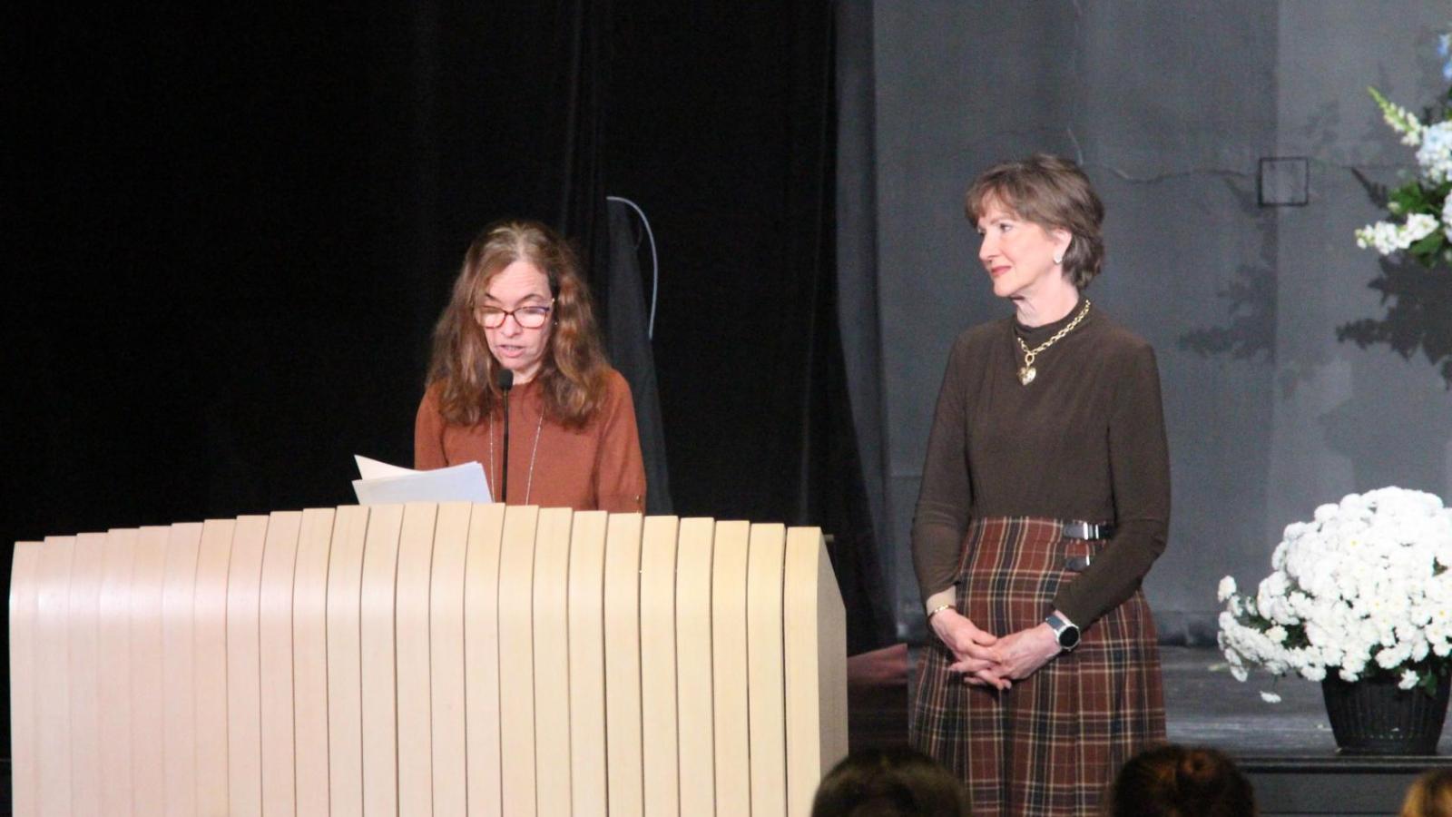 Dean Frazier at podium with Susan Doyle-Lindrud