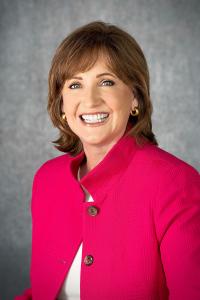 Headshot of Dean Lorraine Frazier wearing bright pink blazer.