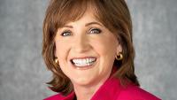 Headshot of Dean Lorraine Frazier wearing bright pink blazer.