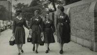 A historical 1960's image of four Columbia Nursing students walking on the sidewalk in Washington Heights.