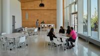 Columbia Nursing staff members conducting a meeting around a table.