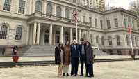 Columbia Nursing students and faculty standing in front of government building