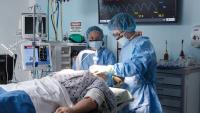 A Columbia nursing faculty member demonstrates intubation to a student in their state-of-the-art simulation center.