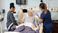 Columbia Nursing students practice care on a patient manikin in the simulation center..