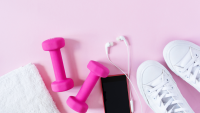 Stock photo with pink dumbbells and fitness equipment