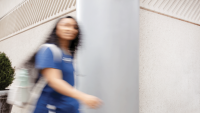 A Columbia Nursing student moving through a blurred pose