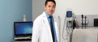 Photo of Jeffrey Kwong, a nurse practitioner, in an exam room