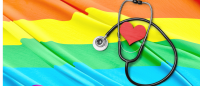 stethoscope laid on a pride flag
