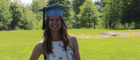 Student wearing graduation cap.