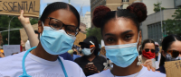 Two nurses at protest.