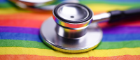 Stethoscope on rainbow flag.