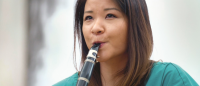 Alumus Erika Chen playing the clarinet.