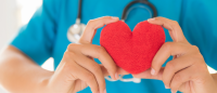 nurse holding heart.