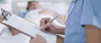 Nurse holding a clipboard.